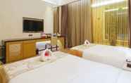 ห้องนอน 5 Tianyuan Junlong Hotel