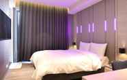 Bedroom 6 Kiwi Share Hotel - Zhongli Station Branch - Hostel