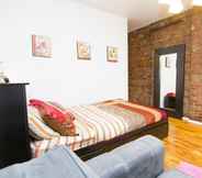 Bedroom 4 Charming Studio on Gramercy