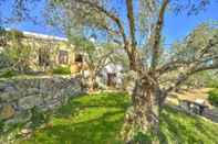 Exterior Picturesque Traditional Stone House