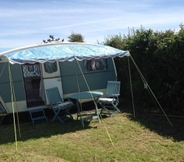 Common Space 4 Kitty Unique 60s Caravan set in Pretty Garden