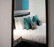 Bedroom 7 Q Square by Supercity Aparthotels