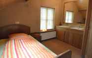 Bedroom 6 Spacious Holiday Home in Wellerlooi With Private Garden