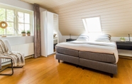 Bedroom 6 Beautiful Holiday Farm in Holten With hot tub and Sauna