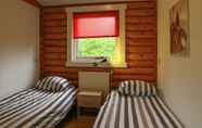 Bedroom 3 Wooden Tree Trunk Bungalow at Fish Pond in Hoge Hexel, Optional With hot tub