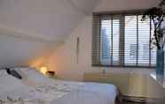 Bedroom 6 Cozy Holiday Home in Noordwijkerhout near Lake