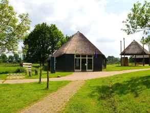 Exterior 4 A Detached Bungalow With Outdoor Fireplace, Covered Terrace and Pond in a Forest Plot