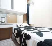 Bedroom 4 The Suites Metro by Hollypro