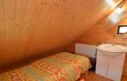 Bedroom 7 A Wooden Chalet Located in a Quiet and Green Environment, for 5 People