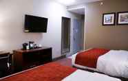 Bedroom 6 Lotus BLU Inn & Suites