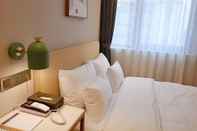ห้องนอน Hotel Londoner Yongwon