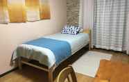 Kamar Tidur 5 I Am Home Guest House 201