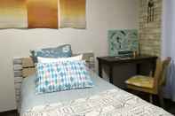 Kamar Tidur I Am Home Guest House 202