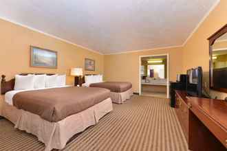 Bedroom 4 Executive Plus Inn & Suites