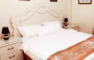 Bilik Tidur 4 Flamingo Suites Boutique Hotel