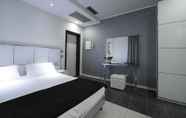 Kamar Tidur 3 Atmosphere Suite Hotel