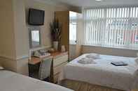 Kamar Tidur Surrey House Hotel