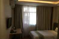 ห้องนอน Guangzhou Minghong Hotel -Xiwan