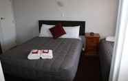 Bedroom 5 Burgundy Rose Motel