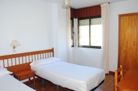 ห้องนอน Apartamentos Turisticos Suaces