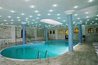 Swimming Pool Amra Palace International Hotel