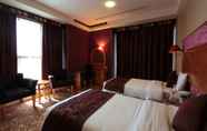 Bedroom 6 Awaliv International Hotel