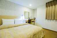 ห้องนอน Sanduo Hotel