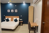 Bedroom Aadat Residency