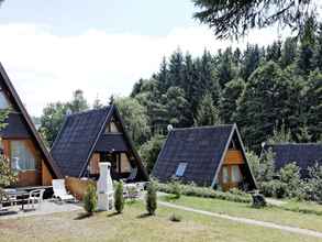 Exterior 4 Wooden Chalet with Terrace near Swimming Lake