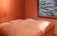 Bedroom 2 Tidy Furnished Wooden Chalet near Forest