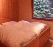 Bedroom 2 Tidy Furnished Wooden Chalet near Forest