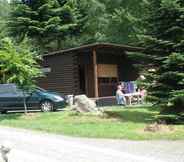 Exterior 3 Tidy Furnished Wooden Chalet near Forest