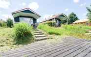 Exterior 3 Beautiful Home With a Veranda and Jetty, Located Near a Pond