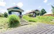 Exterior 3 Beautiful Home With a Veranda and Jetty, Located Near a Pond