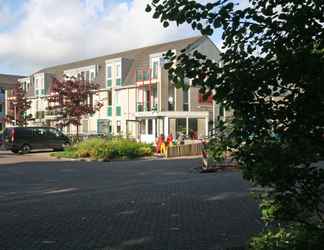 Exterior 2 Well-kept Apartment, a Stone's Throw From the Sea, on Texel