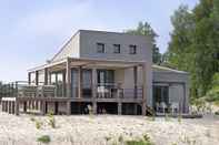 Exterior Luxurious Villa With a Nice Deck, in Nature Reserve De Punt