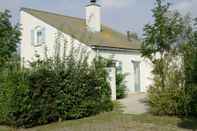 Exterior Spacious Holiday Home With Dishwasher and Fireplace on Texel