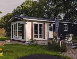 Exterior 2 Comfy Chalet With a Dishwasher, Directly on a Pond