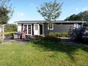 Exterior 4 Comfy Chalet With a Dishwasher, Directly on a Pond