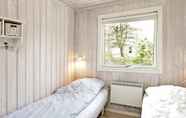 Bedroom 6 Peaceful Holiday Home in Blavand Denmark With Terrace