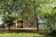 Exterior Lavish Farmhouse in Sint Odilienberg With Terrace