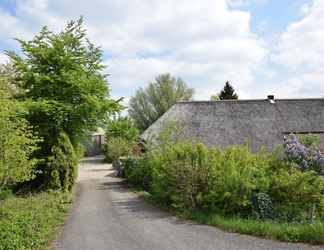 Exterior 2 Quaint Farmhouse near River in Oosterwijk