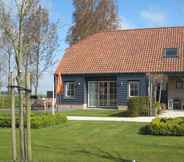 Exterior 2 Stylish Holiday Home in Zuidzande With Sauna