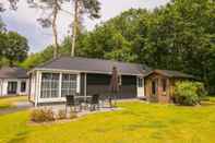 Exterior Modern Designed Chalet With a Smart TV, Next to the Forest