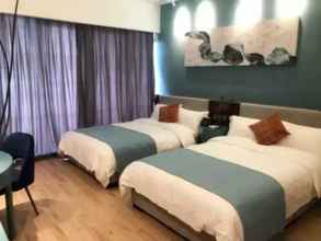 Bilik Tidur 4 Yi Shu Jing Pin Holiday Hotel