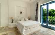 Bedroom 5 Seaside small villa by VillaRentalsgr