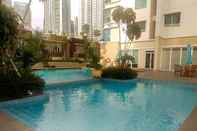 Swimming Pool Modern 3BR Apartment at Springhill Terrace Residence