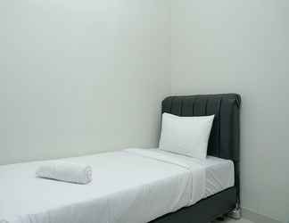 Bedroom 2 Minimalist 3BR Apartment at Puri Mansion