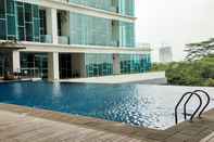 Swimming Pool Cozy and Tidy 1BR Apartment at Brooklyn Alam Sutera