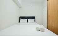 Bedroom 2 Homey and Comfortable 2BR Springlake Summarecon Apartment
